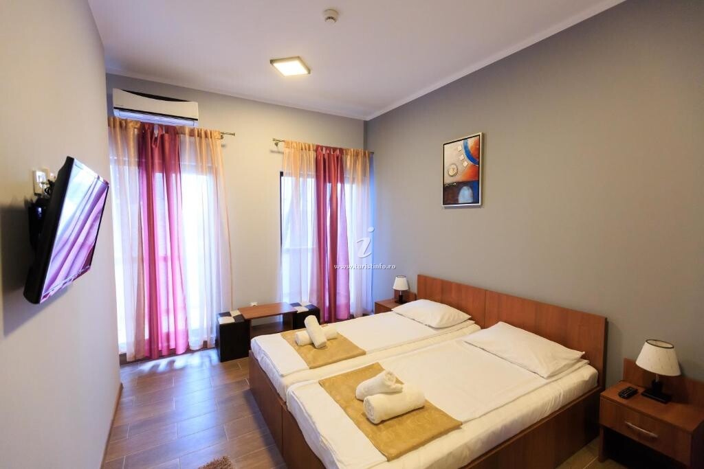 Camere de închiriat Corner Center